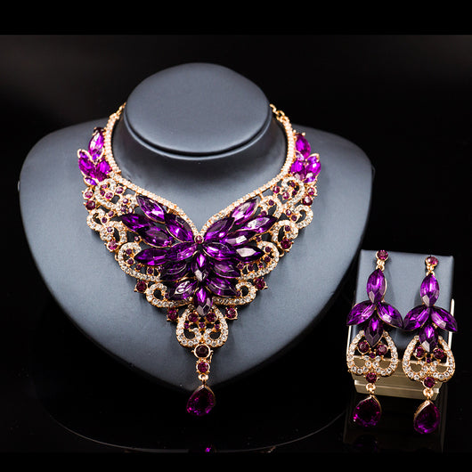 Exaggerated green gemstone necklace and matching dangle earrings set with gold-tone metal and clear accents. - Image 5