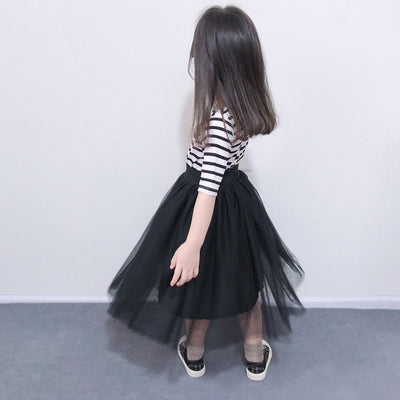 Children's two-piece dress with a black and white striped short-sleeve top and a black gathered tulle skirt. - Image 4