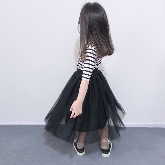 Children's two-piece dress with a black and white striped short-sleeve top and a black gathered tulle skirt. - Image 4