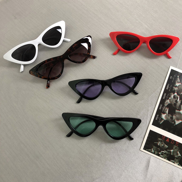 Retro cat-eye sunglasses with a tortoiseshell frame and dark lenses, ideal for a stylish, vintage look.