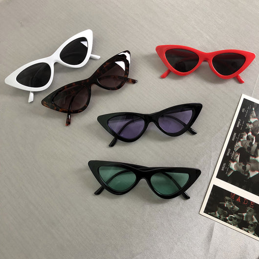 Retro cat-eye sunglasses with a tortoiseshell frame and dark lenses, ideal for a stylish, vintage look.