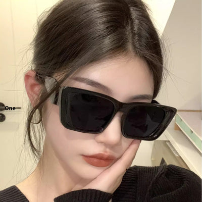 Retro cat-eye sunglasses with a vibrant orange frame, brown temples, and light champagne-colored lenses. - Image 3