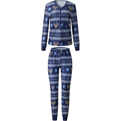 Family of five wearing matching navy blue Hanukkah pajamas with gold menorahs, blue dreidels, and white snowflakes. - Image 8