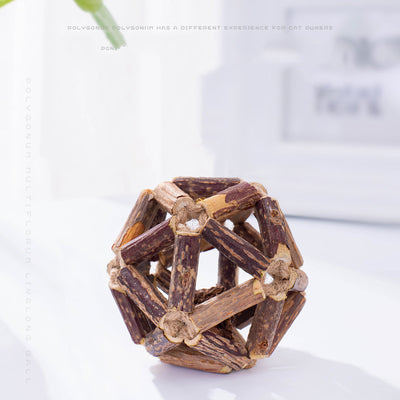 Natural catnip ball toy with a geometric cage made of dark and light brown wooden sticks for cats. - Image 9