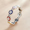 Anillo de Moda con Zircones Brillantes y Detalles Goteo de Color