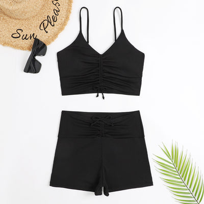 Women's two-piece swimsuit with tropical leaf and floral print. Features a ruched cropped camisole top and high-waisted swim shorts. - Image 4