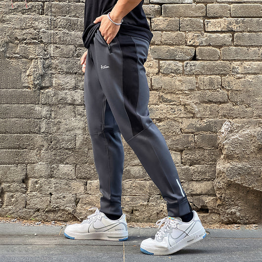 Pantalones de Chándal con Bolsillos de Cierre y Tela Elástica - Image 12