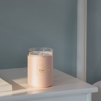 Light pink mini USB humidifier diffuser, shaped like a candle, with a clear top and visible mist output. - Image 4