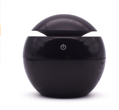 Black spherical ultrasonic atomizer with a power button icon, designed for aromatherapy and humidification. - Image 9