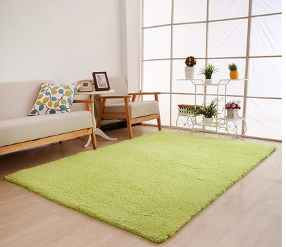 Fluffy purple rectangular area rug on a light wood floor in a modern living room with a sofa and plant stand. - Image 5