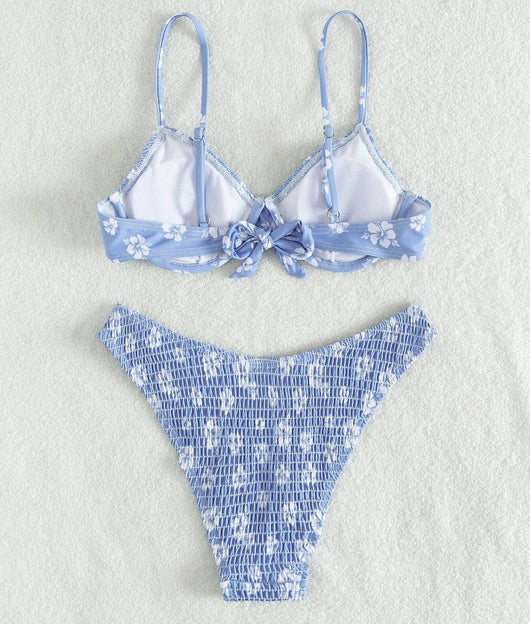 Periwinkle blue two-piece swimsuit with white floral pattern and ruched texture, featuring an underwire bikini top and high-cut bottoms. - Image 16