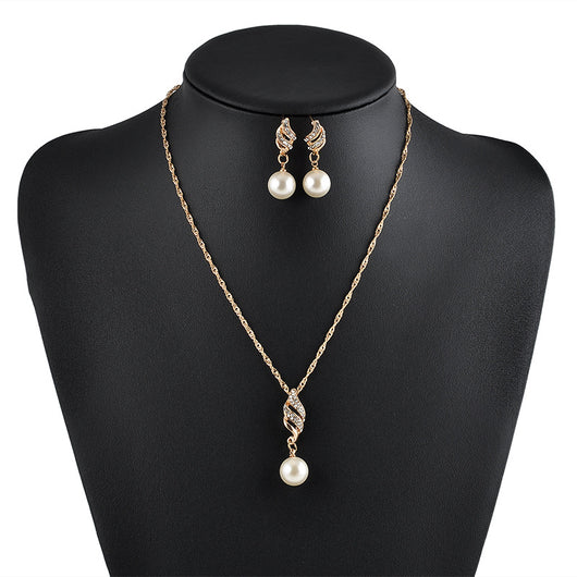 Gold-tone necklace and dangle earring set with faux pearls and clear rhinestones, displayed on a black bust. - Image 2
