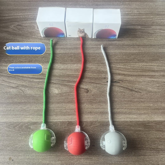 Gray intelligent automatic cat teasing ball with a clear section and braided cord, next to its white product box.
