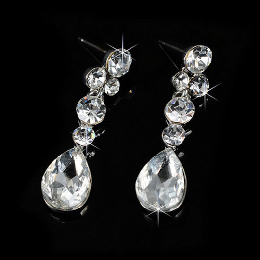 Sparkling silver-tone rhinestone necklace and matching teardrop earrings set on a black background. - Image 3