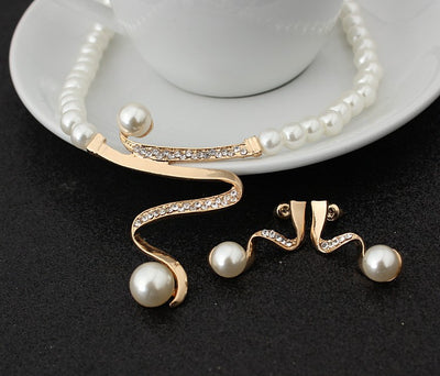 White pearl necklace and matching stud earrings set with gold-tone wavy metal and clear crystal accents. - Image 5