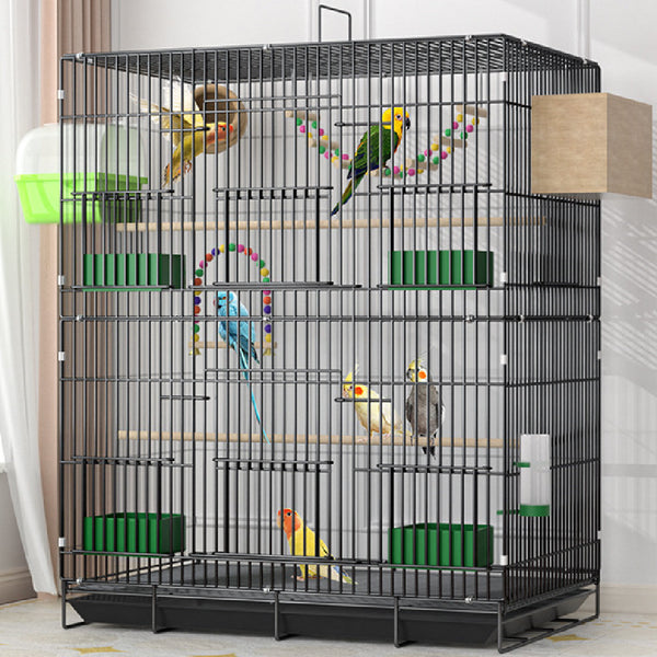 Black double-layer metal bird cage with multiple perches, green food/water dishes, and toys, housing several colorful birds.
