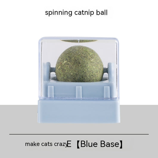 Two spinning catnip balls, one with a green base and one with a blue base, in clear plastic cases. - Image 3