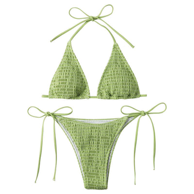 Women's lime green halter bikini with spaghetti straps and thong bottom, modeled outdoors against a blue sky. - Image 5