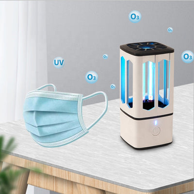 White portable UV disinfection lamp with a black top and base, featuring a visible blue UV light tube and power button.
