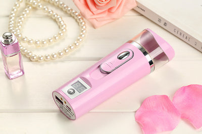 White and rose gold nano spray water meter with a clear tank, digital display, and power button. - Image 7