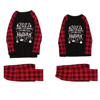 White long-sleeve pajama top with "wild one" graphic and red and black plaid pants. - Image 9