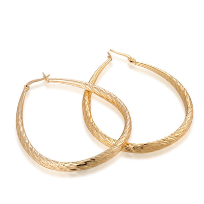 Aretes Dorados en Gota con Textura y Acabado Mate - Image 2