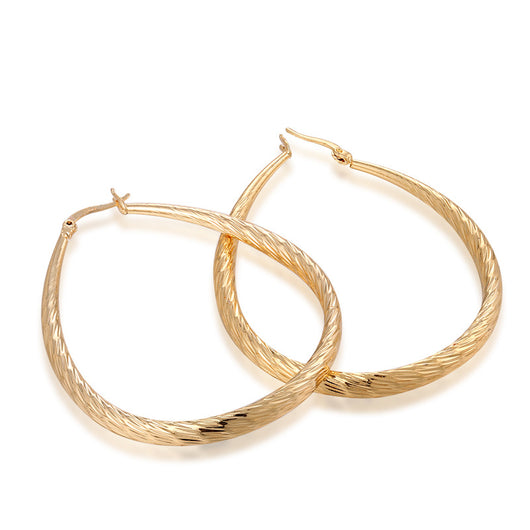 Aretes Dorados en Gota con Textura y Acabado Mate - Image 2