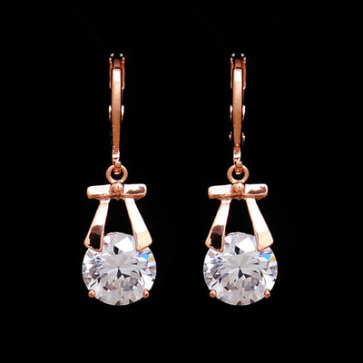 Rose gold-toned jewelry set with a necklace and matching dangle earrings, each featuring a round clear crystal. - Image 2