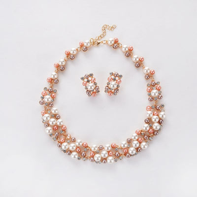 Gold-toned heart-shaped necklace and dangle earrings set with clear rhinestones and faux pearls. - Image 6