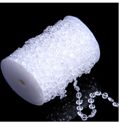 Coiled strand of clear faceted acrylic beads linked with silver rings, ideal for DIY curtains or wedding decor. - Image 2