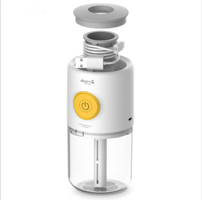 White and clear mini USB ultrasonic mist aroma essential oil diffuser with a yellow power button and gray top. - Image 2