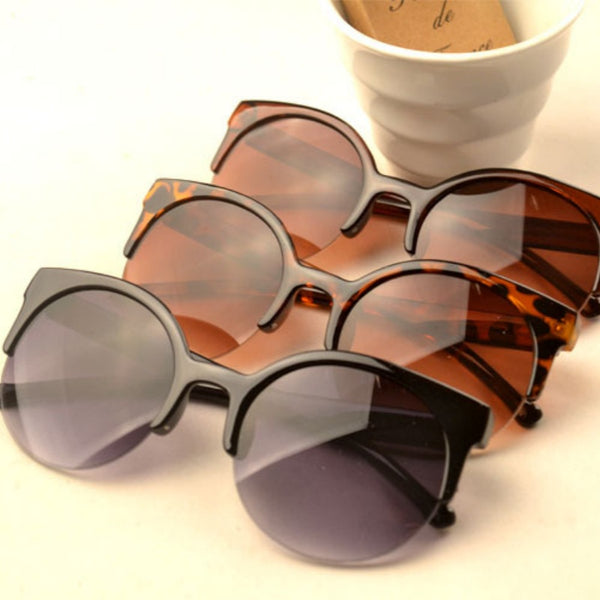 Half frame cat eye retro sunglasses with brown gradient lenses and a tortoiseshell-patterned frame.