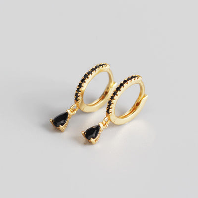 Silver-colored hoop earrings with black pave stones and dangling black teardrop-shaped stones. - Image 8