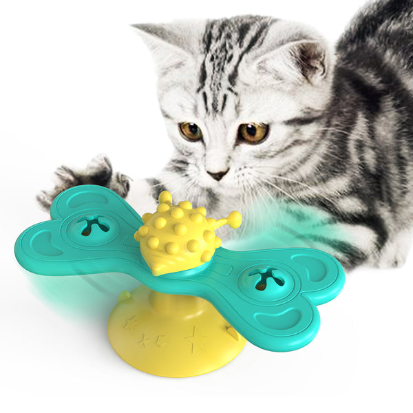 Green and yellow butterfly cat turntable toy with a textured ball, designed as a bite toy for cats.