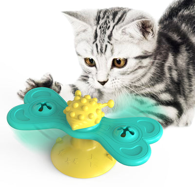 Green and yellow butterfly cat turntable toy with a textured ball, designed as a bite toy for cats.