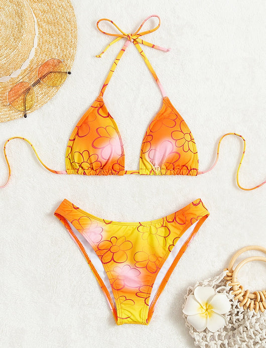 Yellow and orange floral string bikini swimsuit for women, featuring a triangle top and high-cut bottoms by a pool. - Image 9