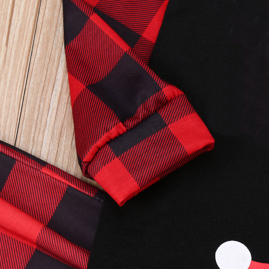 Family matching Christmas pajamas with black tops, red plaid sleeves, and Santa wearing a mask, paired with red plaid pants. - Image 25