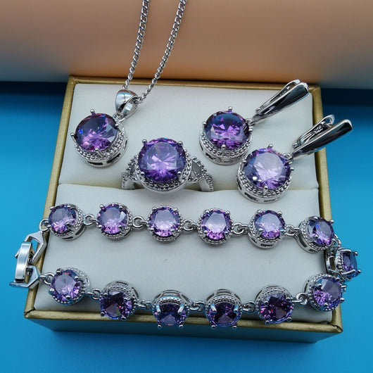 Four-piece silver-tone jewelry set with round green gemstones, including a necklace, bracelet, ring, and dangle earrings. - Image 19