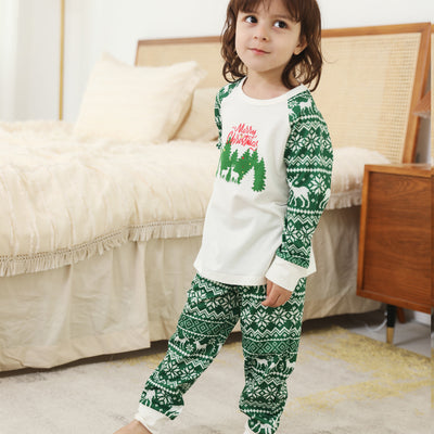 Family of three wearing matching white and green Christmas pajamas with reindeer and "Merry Christmas" text. - Image 10
