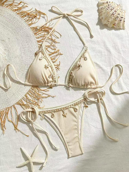 Light pink ribbed halterneck bikini with triangle cups and tie-side bottom, adorned with shell and starfish charms. - Image 7