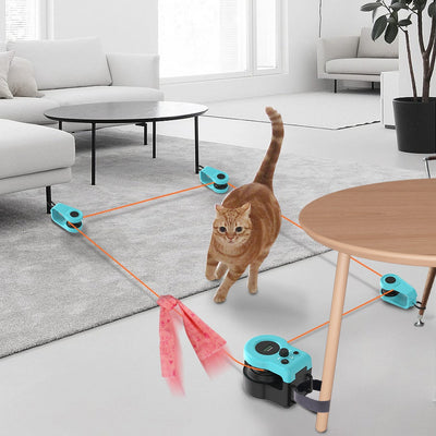 Blue and black cat weight loss remote control sound toy with string and feather, shown with a tabby cat playing. - Image 8
