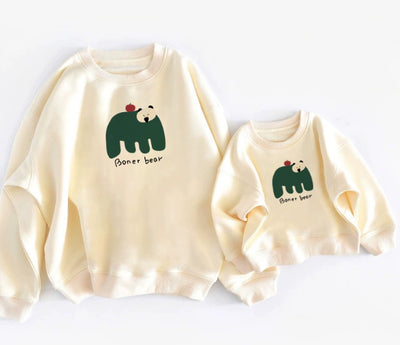 Matching cream crew neck sweatshirts, one adult and one child size, with a dark green bear graphic and "Boner bear" text. - Image 10