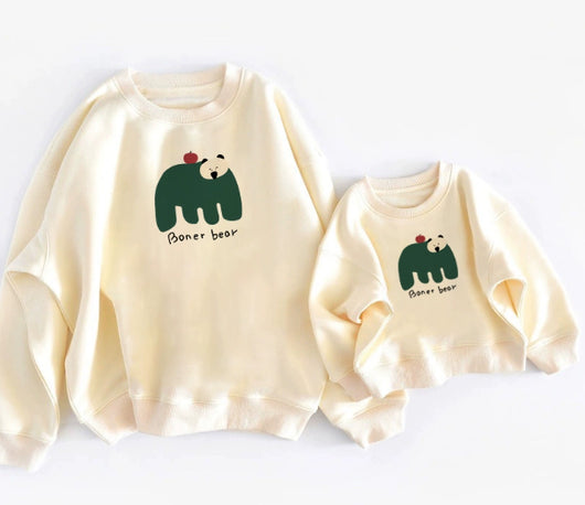 Matching cream crew neck sweatshirts, one adult and one child size, with a dark green bear graphic and "Boner bear" text. - Image 10