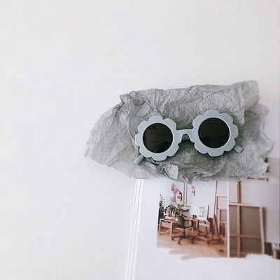 Orange flower-shaped sunglasses for babies and toddlers with dark lenses and a plastic frame. - Image 4