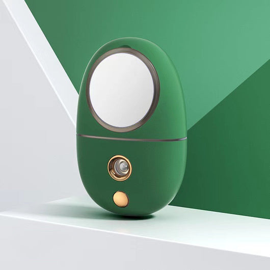 White egg-shaped portable facial humidifier with a pink cartoon rabbit inside a clear dome, gold nozzle and button. - Image 18