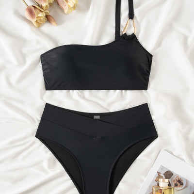 Black one-shoulder bikini with a gold-tone metal buckle detail and high-waisted bottoms with a V-front design. - Image 4