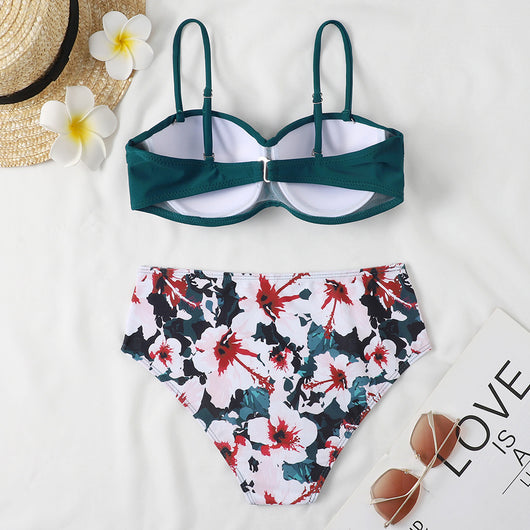 Teal twisted bandeau bikini top with tropical leaf print high-waisted bottoms on a model wearing a white shirt. - Image 15