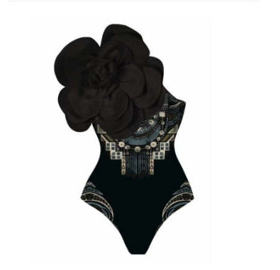 Black one-piece swimsuit with a large 3D flower on one shoulder and a geometric pattern on the bodice. - Image 31
