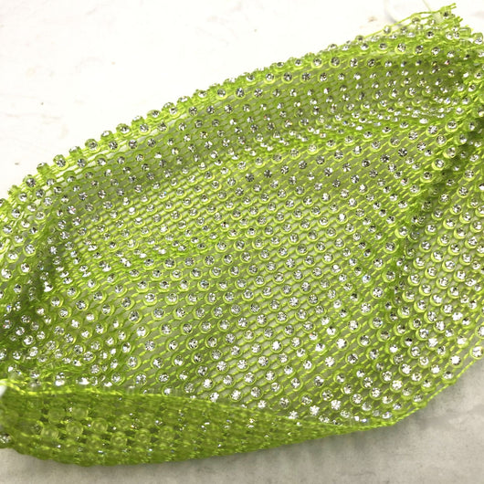 Close-up of a blue mesh fabric adorned with numerous small, clear rhinestones, creating a sparkling texture. - Image 10