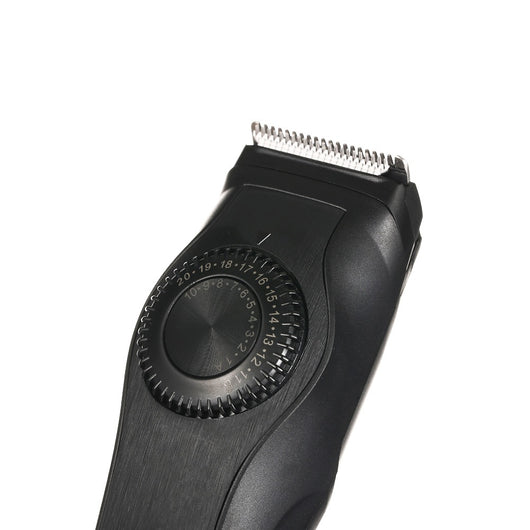 Black adjustable electric hair clipper with two guide combs, USB cable, oil, and cleaning brush, shown with its retail box. - Image 4